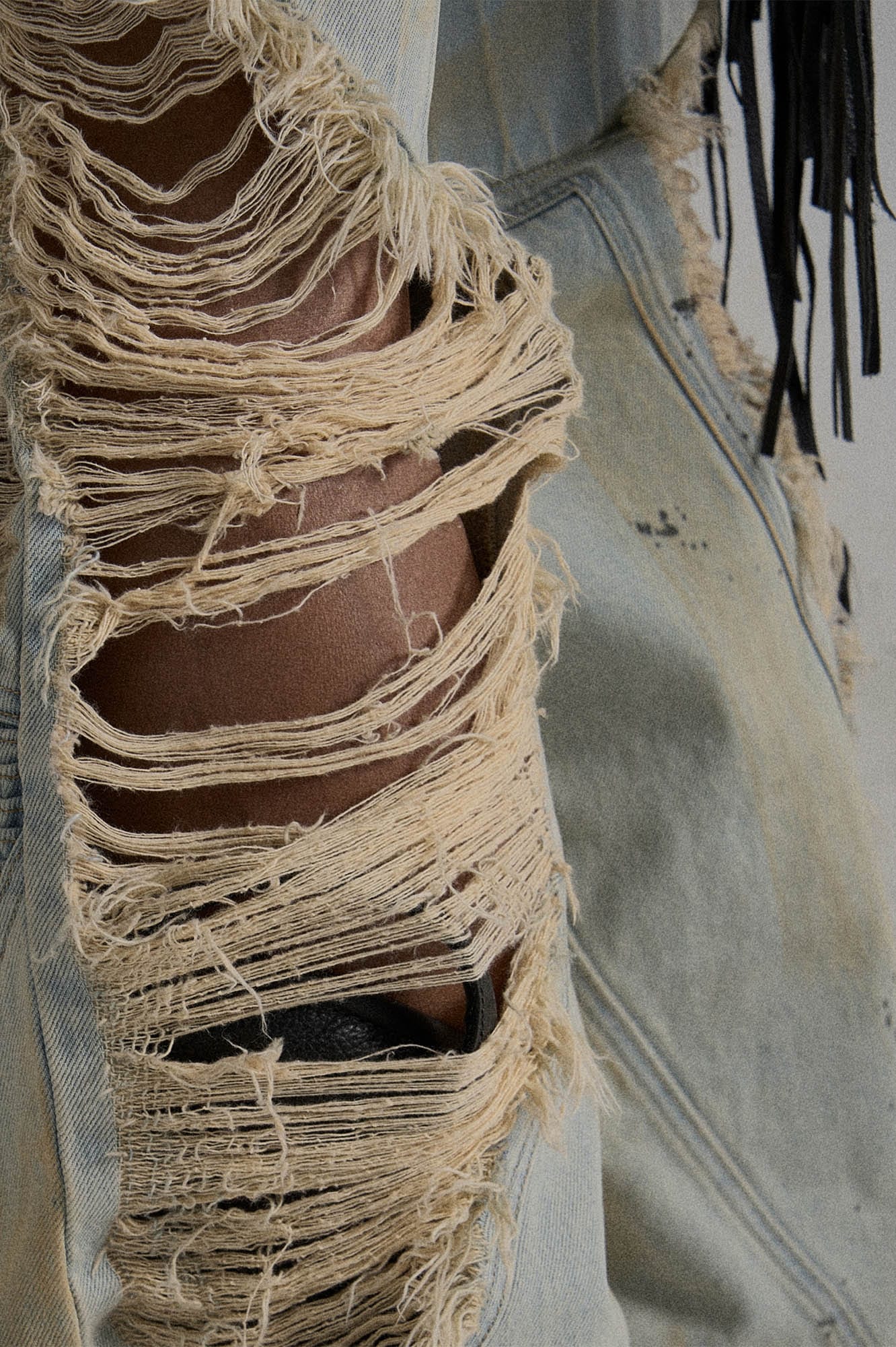 Paneled Heavily Ripped Fringe Jeans