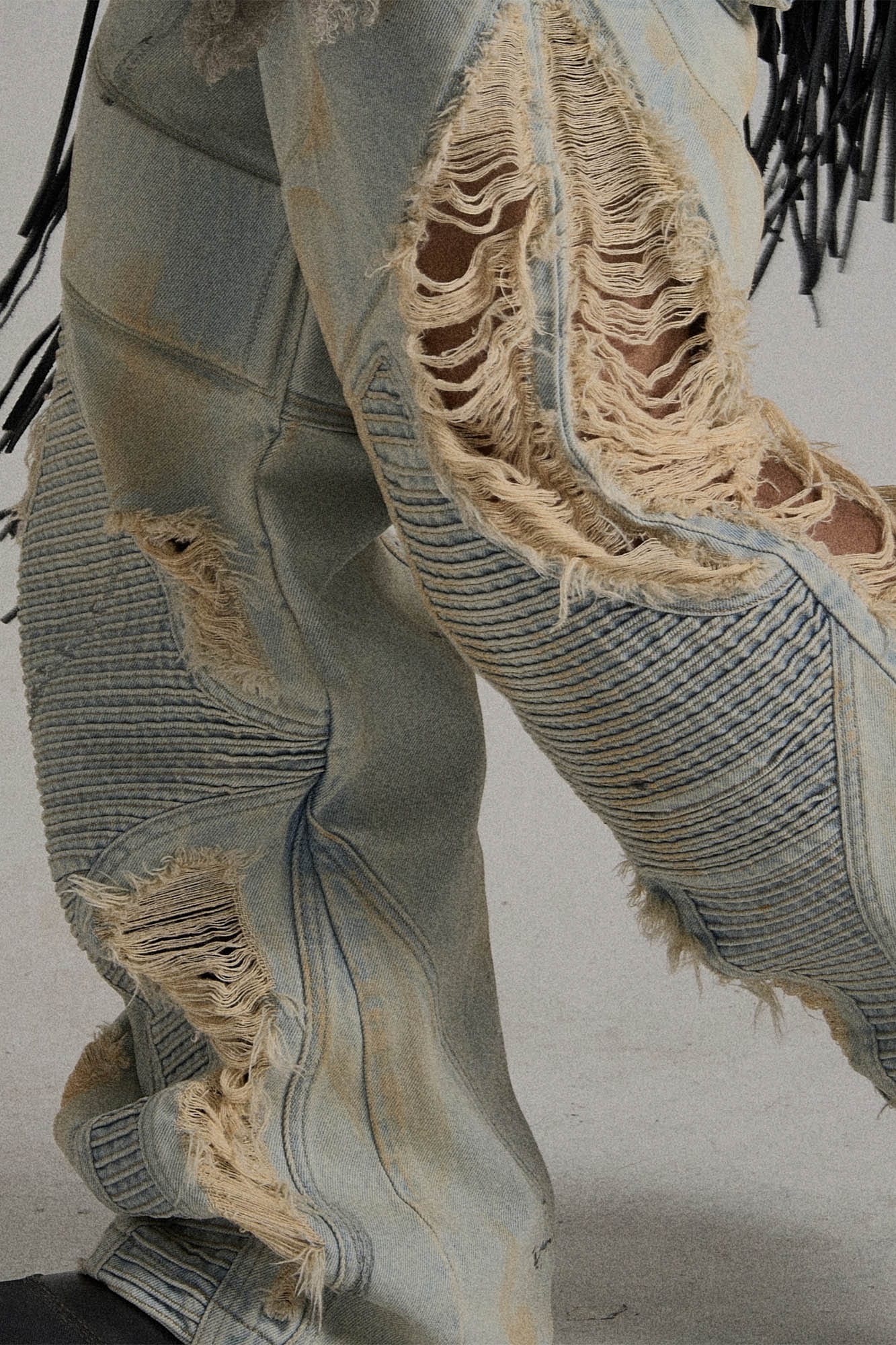 Paneled Heavily Ripped Fringe Jeans