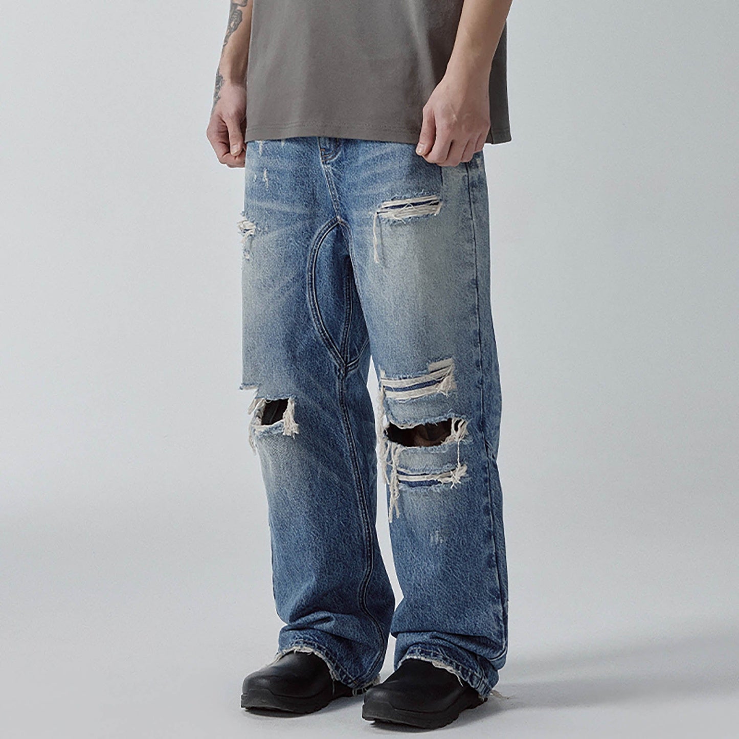 Ripped Curved Spliced Jeans