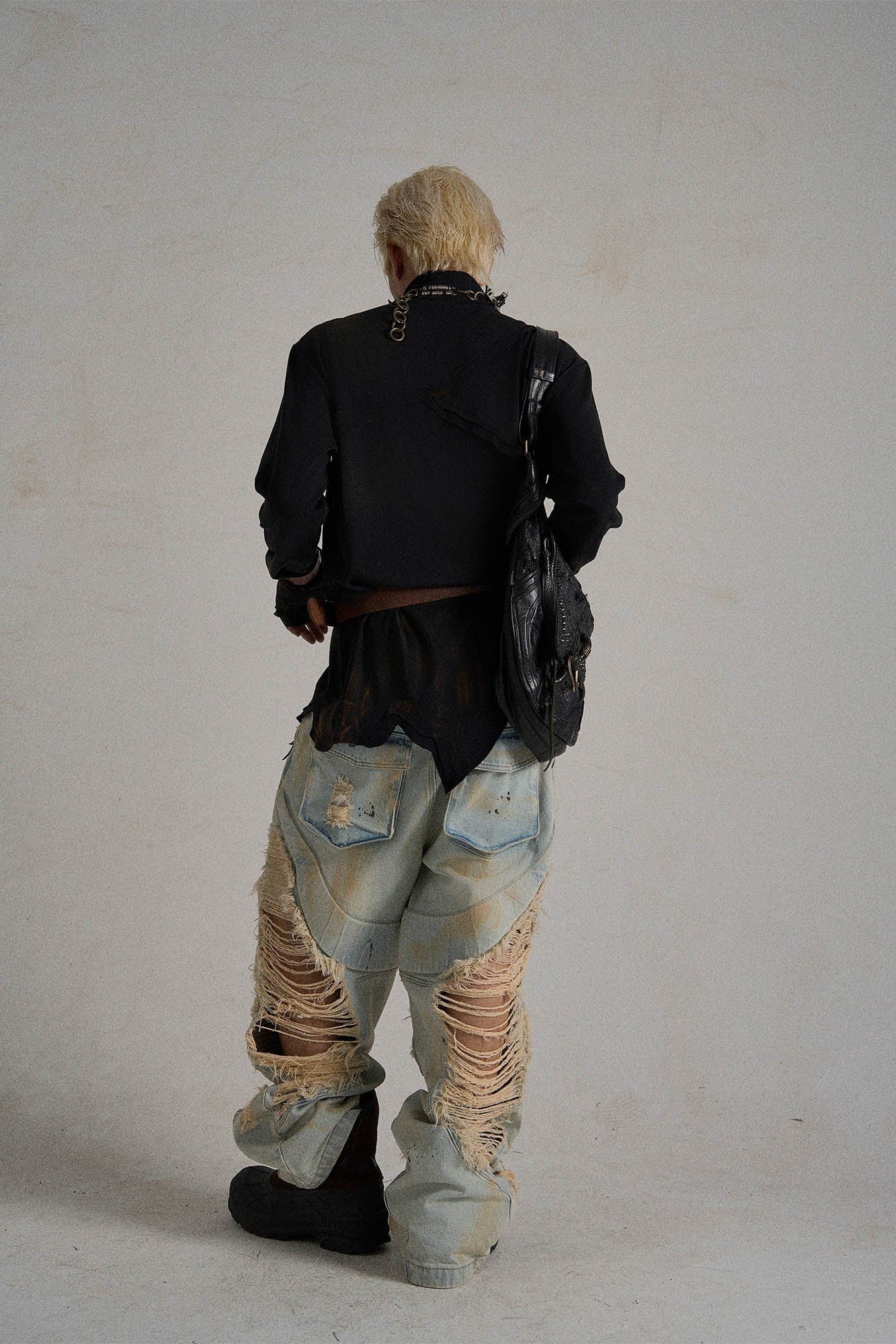 Paneled Heavily Ripped Fringe Jeans
